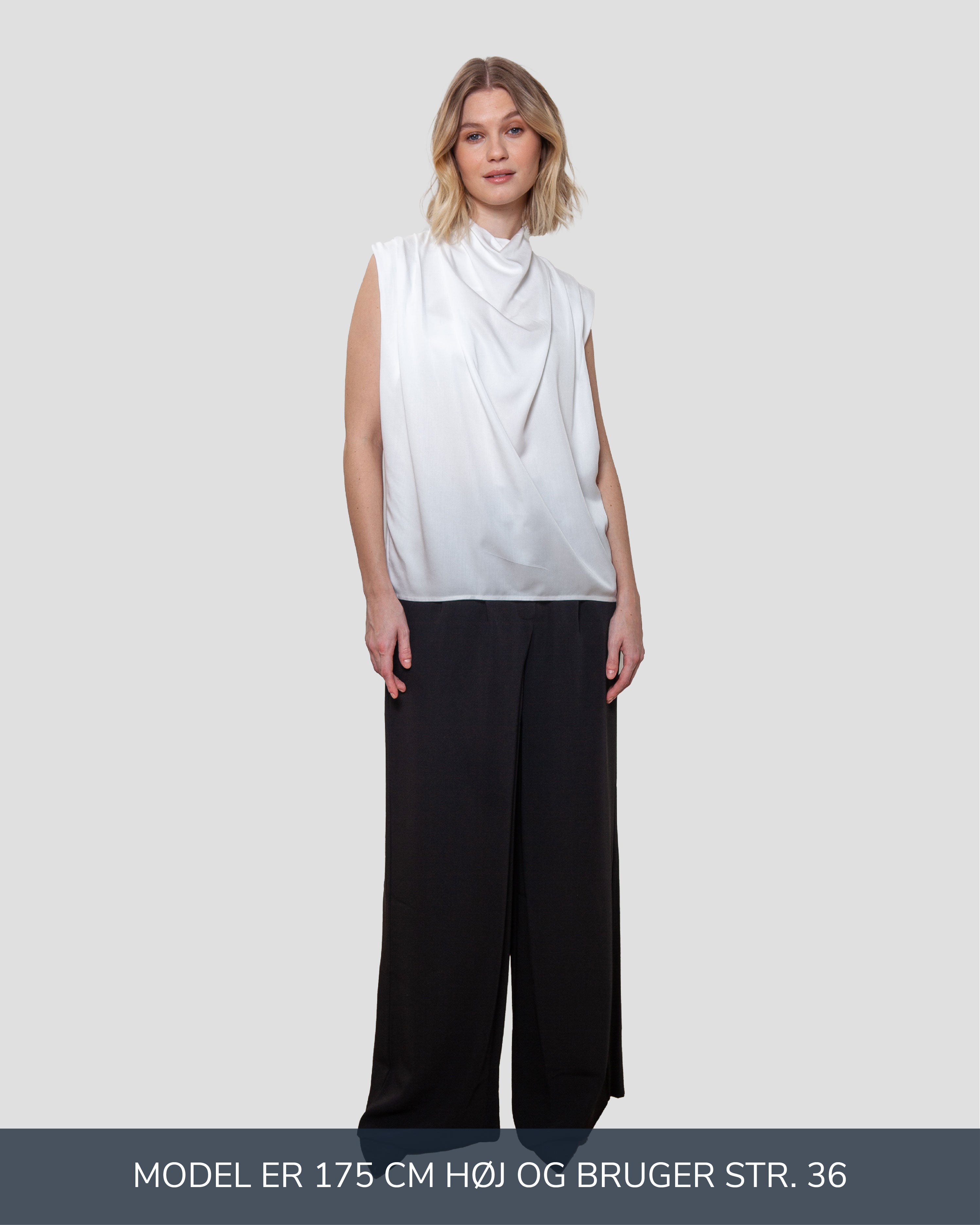 Draperet bluse uden aermer i hvid lavet af kvaliteten 100% Viskose (LENZING™ ECOVERO™), ansvarligt produceret design fra A Working Theory